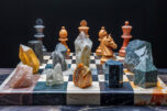 Chessboard with rare earth element pieces create a visual metaphor with a chessboard where the pieces are made from different rare earth elements